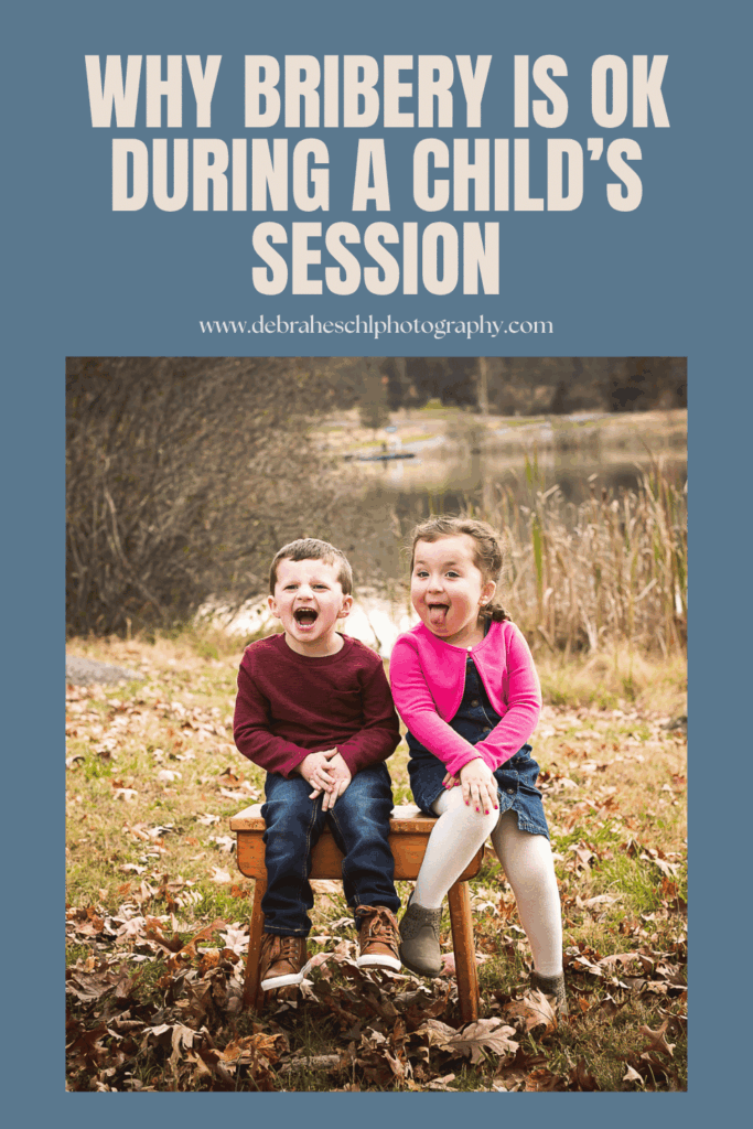 Two joyful children sitting on a bench, playfully sticking out their tongues. The text above reads "Why bribery is OK during a child’s session."