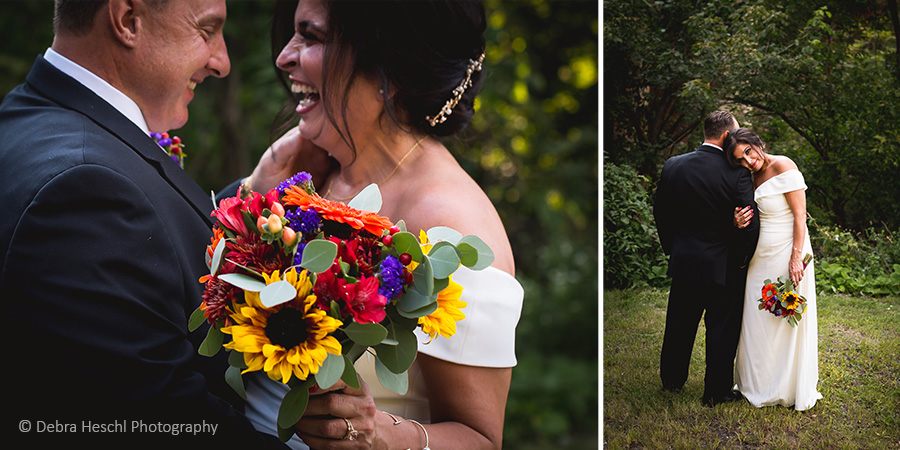 Bride and groom laughing together over her sunflower bouquet and embracing from behind on the wedding path.