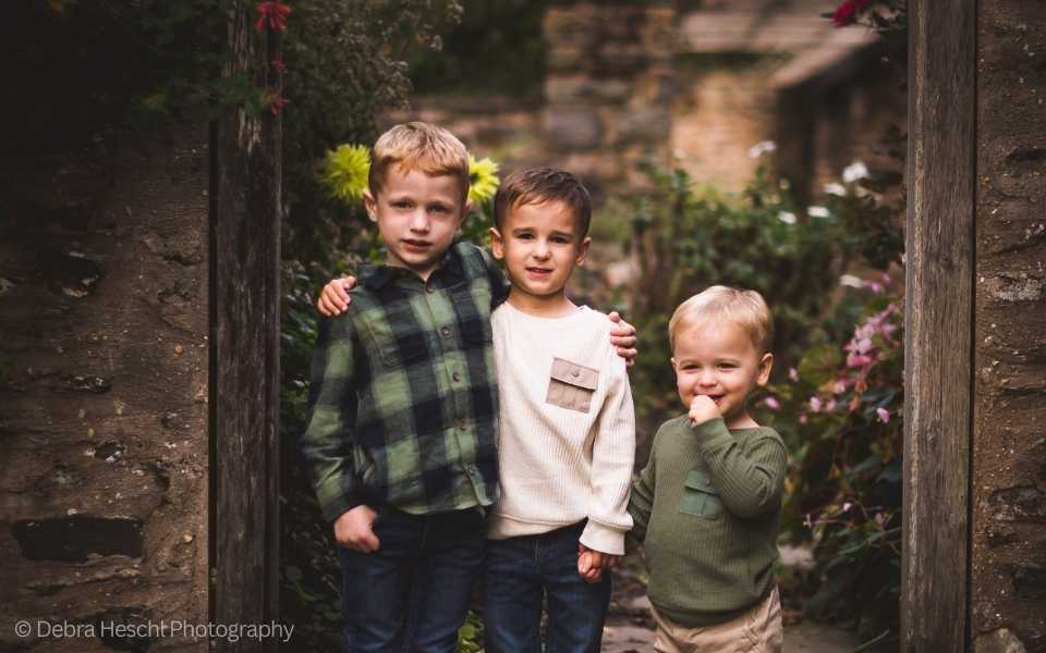 Three little brothers posing for a photo at Harriton House in Bryn Mawr, Pa.