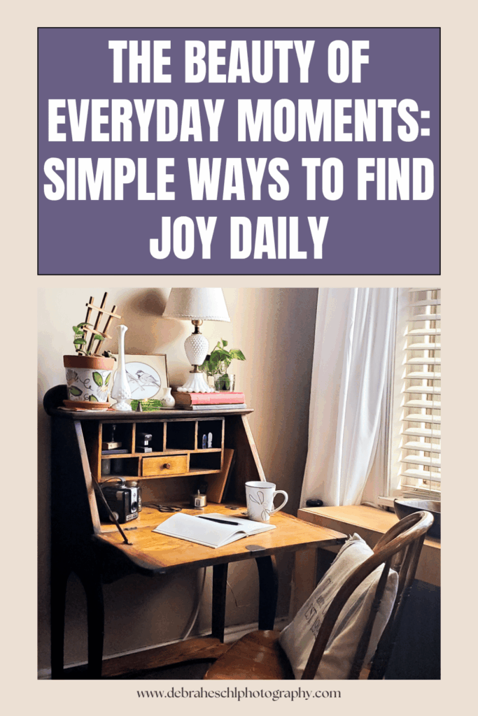 Cozy wooden desk by a window, adorned with plants, a lamp, and a notebook. A peaceful scene capturing everyday joy and simplicity. Sign: "The Beauty of Everyday Moments."
