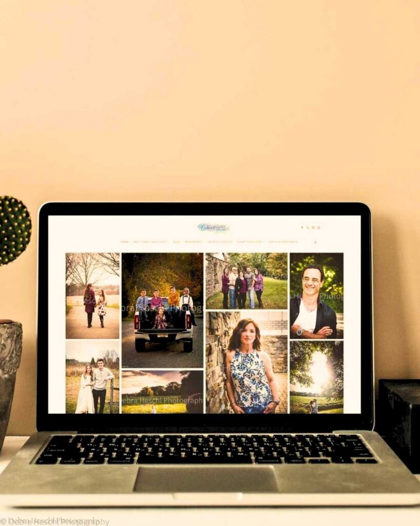 Laptop displaying a photography portfolio featuring family and individual portraits against outdoor backdrops. A cactus sits next to the laptop, creating a warm, inviting ambiance.