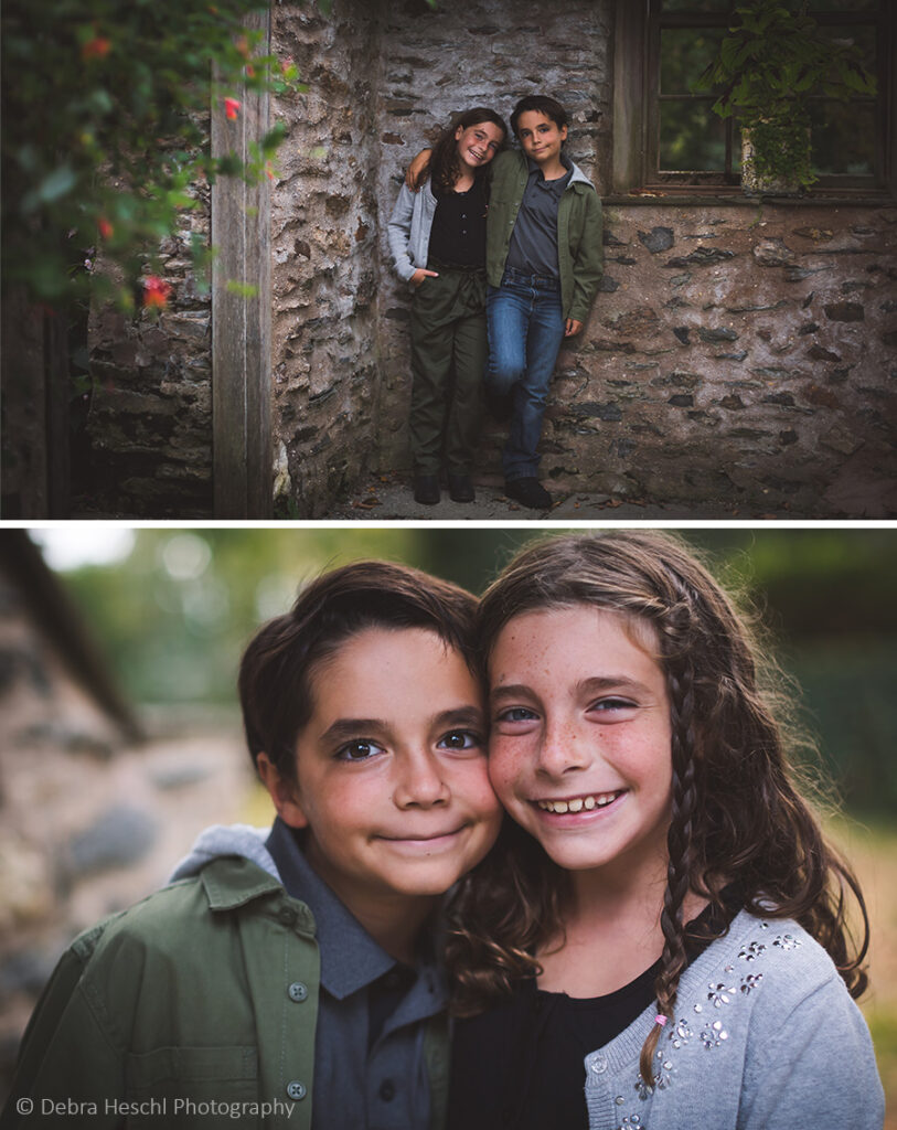 Twin siblings smiling together during their family photography session at Harriton House in Bryn Mawr, Pennsylvania.