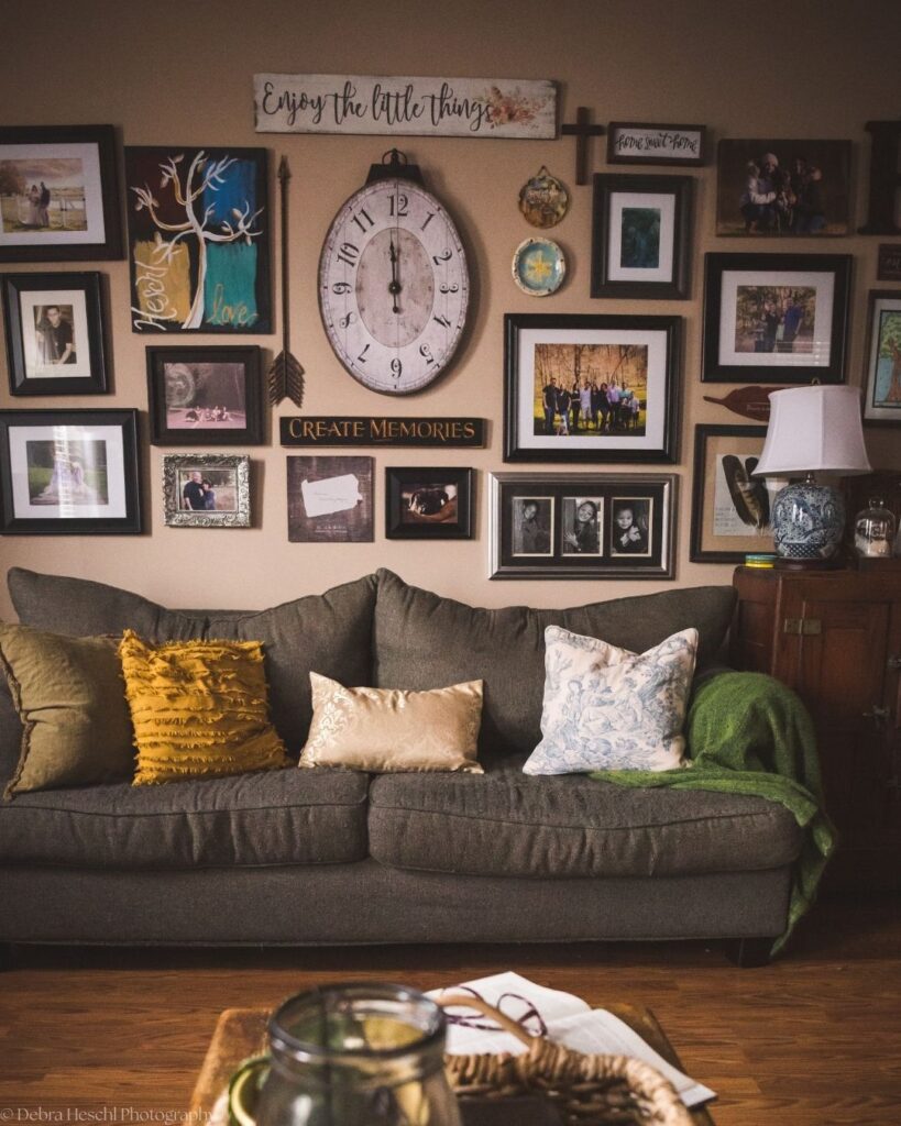 Updated wall gallery featuring family photos, vintage décor, meaningful keepsakes, and artwork in a cozy living room.